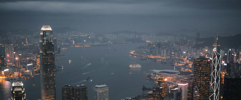 Central and Victoria Harbour seen from the Peak at nightfall under low cloud